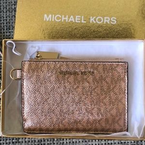 Michael Kors metallic rose gold wallet/wristlet